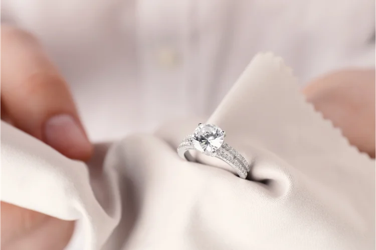 Drying diamond ring with soft lint free cloth after rinsing with clean water after accidentally showering with it.